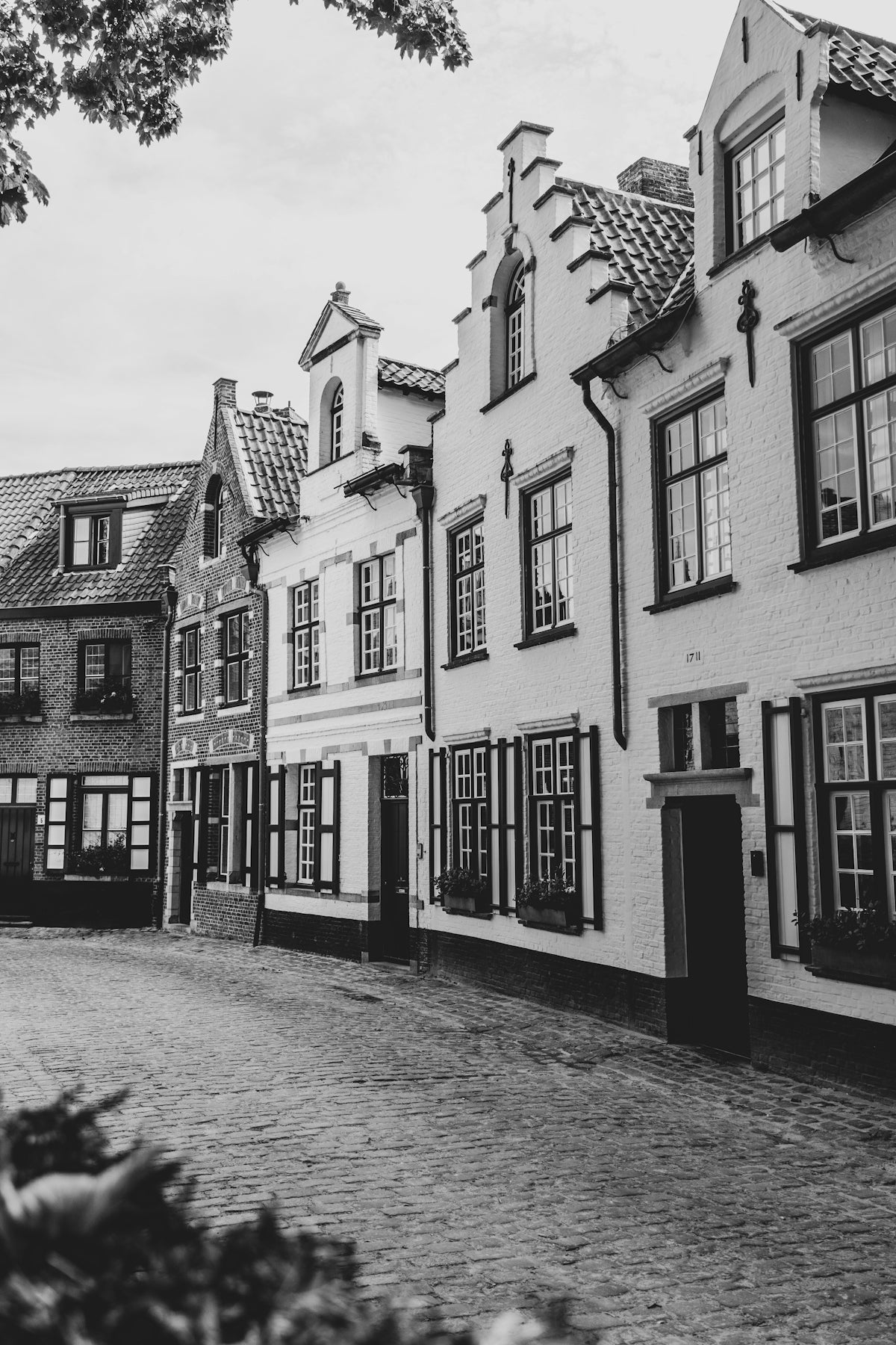 a cobblestone street with buildings on either side of it